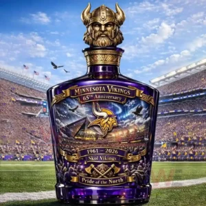 Decorative Minnesota Vikings anniversary bottle with Viking helmet topper standing on a football field in a crowded stadium!