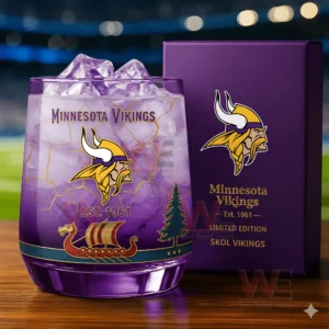 Minnesota Vikings themed whiskey glass with purple drink ice cubes and decorative design next to a branded collector box!