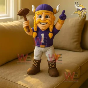 Viking mascot plush figure holding a football hammer and raising one hand on a couch!