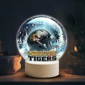 Snowy themed decorative globe with a Missouri Tigers helmet on a white stand!