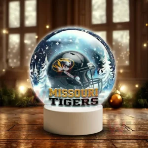 Snow globe style display featuring a Missouri Tigers helmet on a white base in a winter scene!