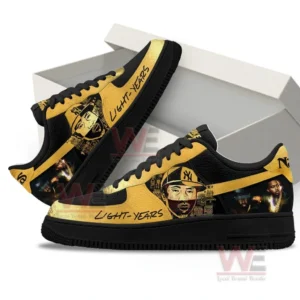 Gold and black Nas Light Years inspired sneakers with portrait artwork and script text shown with an open white shoebox on a clean background!