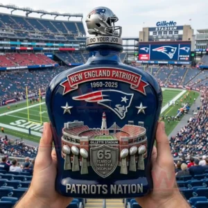 New England Patriots 65th Anniversary 1960-2025 Whiskey Bottle 4 New England Patriots commemorative whiskey bottle held by fans inside the stadium!
