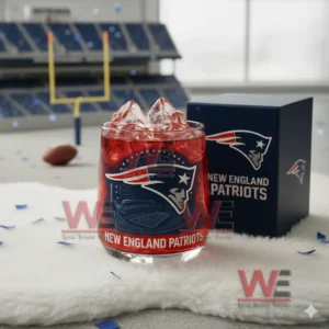 A red ice Patriots glass beside a blue team box with a stadium goalpost in the background!