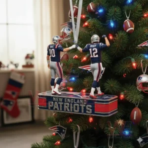 New England Patriots Maye and Brady Fist Bump Christmas Ornament 4 Football themed Christmas ornament hanging on a tree with lights and sports decor in a living room!