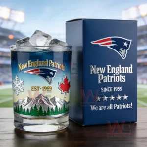 New England Patriots themed whiskey glass with blue drink ice cubes and decorative design next to a branded collector box!