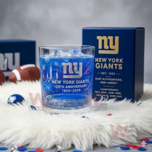 New York Giants anniversary glass with blue iced drink beside a dark blue box showing the team logo and championship information!