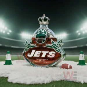 A crown topped Jets bottle standing on a rug in a bright stadium environment!``