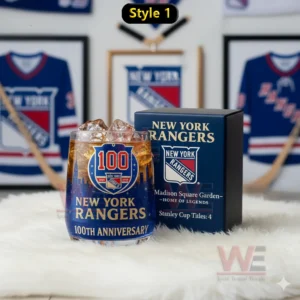 New York Rangers anniversary glass with amber iced drink beside a dark blue box in a room decorated with jerseys and hockey items!