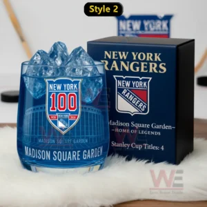 New York Rangers centennial glass with blue iced drink beside a dark blue box featuring team emblem and arena references!