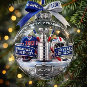 A clear round ornament shows a silver trophy a blue jersey a helmet and celebratory banners for a hockey teams centennial!