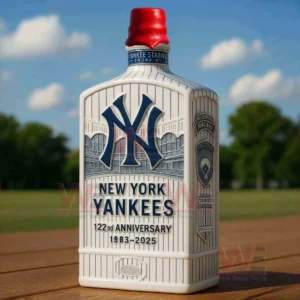 New York Yankees 122nd Anniversary 1903-2025 Whiskey Decanter 5 New York Yankees commemorative bottle with red cap standing on a wooden table against a green field background!