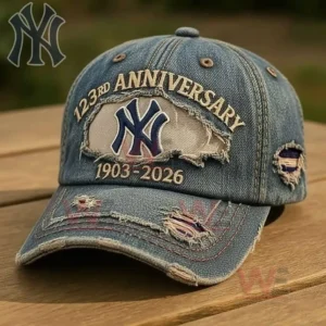 Distressed blue denim New York Yankees anniversary baseball cap with embroidered logo anniversary text and vintage worn details.