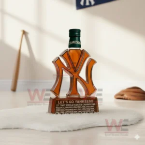 New York Yankees whiskey bottle with amber liquid and green cap displayed on white fur in a minimalist interior!
