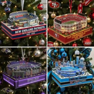 Multiple football team stadium anniversary ornaments hanging on a Christmas tree with lights and team themed decorations!