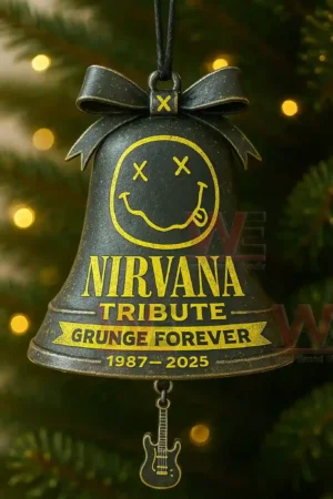Black bell ornament with smile face hanging on a decorated tree with warm lights!