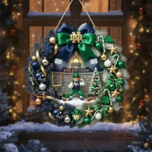 Notre Dame Fighting Irish football Notre Dame Stadium Christmas Wreath 6 A holiday wreath with team colors and a central stadium display shown against a snowy window background!
