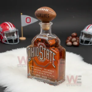 An Ohio State bottle with football cap on white fur with helmets flags and buckeye nuts around it.