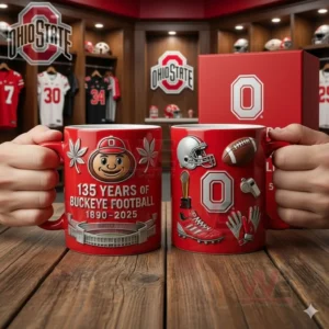 Hands holding two Ohio State football themed mugs on a wooden table inside a locker room!