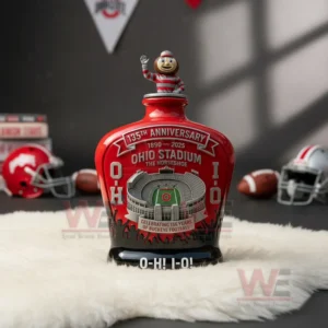 Ohio Stadium anniversary glass bottle with mascot topper on white rug surrounded by football themed interior decor!