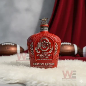 A rider topped Ohio State bottle displayed on a rug with footballs in the background!