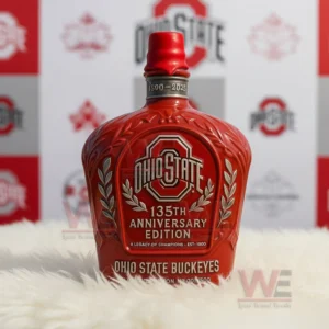 A red capped Ohio State bottle placed on a rug with a backdrop of team logo panels!```