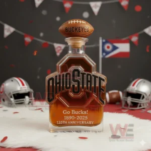 An Ohio State anniversary bottle with a football cap displayed with helmets confetti and an Ohio flag in the background.