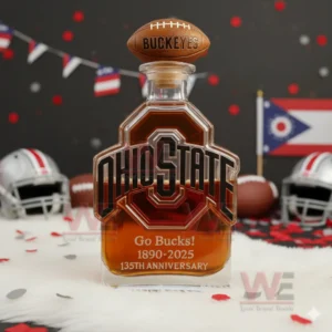Ohio State Buckeyes Go Bucks 1980-2025 135th Anniversary Custom Whiskey Bottle 5 An Ohio State anniversary bottle with a football cap on white fur with helmets confetti and an Ohio flag behind it.