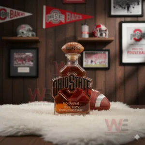A Buckeyes bottle stands on a soft white rug surrounded by team decor including helmets banners and framed images!