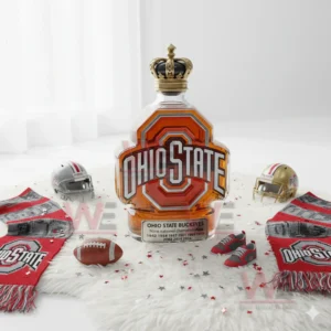 Ohio State Buckeyes Nine championships Whiskey Bottle 4 A decorative Ohio State bottle with a crown top positioned among team themed accessories on a white rug.