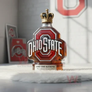 Ohio State bottle with gold crown topper on white furry surface in bright room.