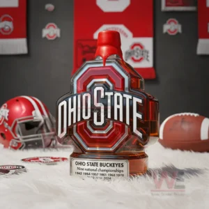 Ohio State emblem bottle with red cap displayed among football themed decorations.