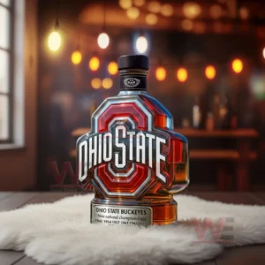 Ohio State Buckeyes Nine National Championships Custom Whiskey Bottle 7 Ohio State emblem bottle sitting on a soft surface in a bar environment with warm glowing lights in the background!