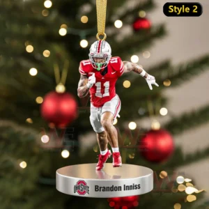 Ornament of Brandon Inniss in action on a base with a Christmas tree background!