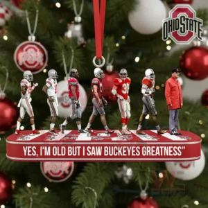 Close view of Buckeyes figures standing on a red platform with a Christmas tree in the background!