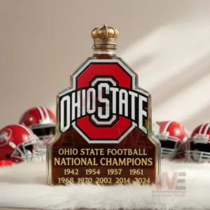 Ohio State National Championship Whiskey Bottle 4 Ohio State emblem bottle with gold crown cap placed before football helmets.