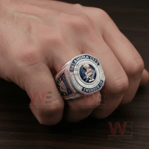Oklahoma City Thunder themed ring featuring a circular emblem blue center stone and diamond accents!