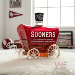 Oklahoma Sooners 130 Years Of Oklahoma Football Whiskey Bottle 6 A Sooners wagon bottle sits on a white rug with team decor including helmets flags and a framed stadium image!