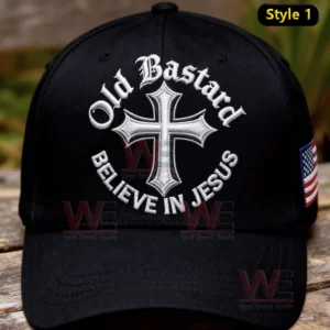 Black baseball cap with embroidered cross and faith themed message placed on a wooden surface!