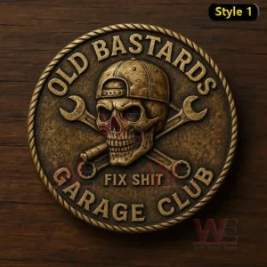 A circular coin with a skull cap crossed wrenches and a cigar symbolizing a garage club!