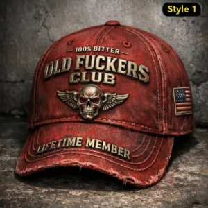 Distressed red baseball cap with Old Fuckers Club 100 percent bitter text winged skull emblem Lifetime Member embroidery and an American flag side patch.