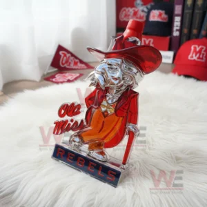 A character shaped Rebels bottle rests on a fluffy white rug with caps flags and team items arranged nearby!