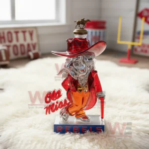 Ole Miss Rebels Colonel Reb Custom Whiskey Bottle 7 A Rebels figure bottle rests on a fluffy rug with sports gear and team decor arranged throughout the room!