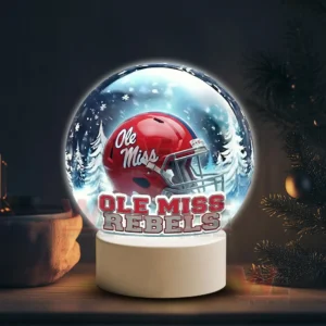 Snow globe style display featuring an Ole Miss Rebels helmet on a white base in a winter scene!