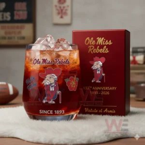 Ole Miss Rebels anniversary glass with red iced drink beside a deep red box in a room with team signs and football elements!