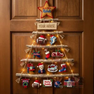 Ole Miss Rebels Premium Rustic Wall Christmas Tree 4 A wooden door showing a rustic wall tree adorned with ole miss rebels themed ornaments and warm lights!