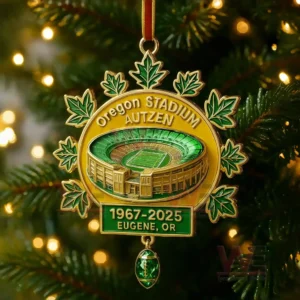 An Autzen Stadium ornament with green seating a gold exterior leaf accents and commemorative dates displayed in bright green and gold!