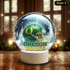 Snowy themed decorative globe with an Oregon Ducks helmet on a white stand!