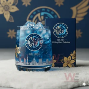 Orlando Valkyries Whiskey Glass 4 A blue iced Orlando Valkyries themed glass positioned before its matching collection box with patterned decor behind it!