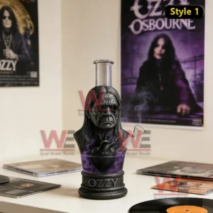 Pipe mug with sculpted face design placed on a table with music records and posters in the background!